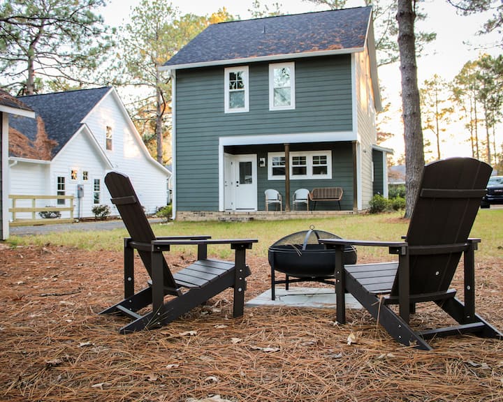 Firepit and Adirondack chairs in the cottage’s backyard